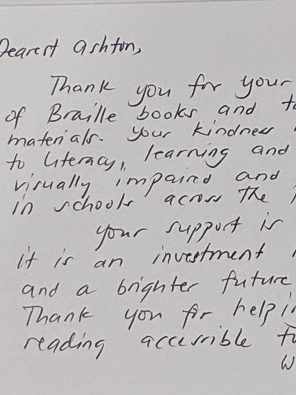 Handwritten thank-you card addressed to Ashton from the Rotary Club of Historic Filipinotown, thanking him for the donation of Braille and tactile books for students across the Philippines